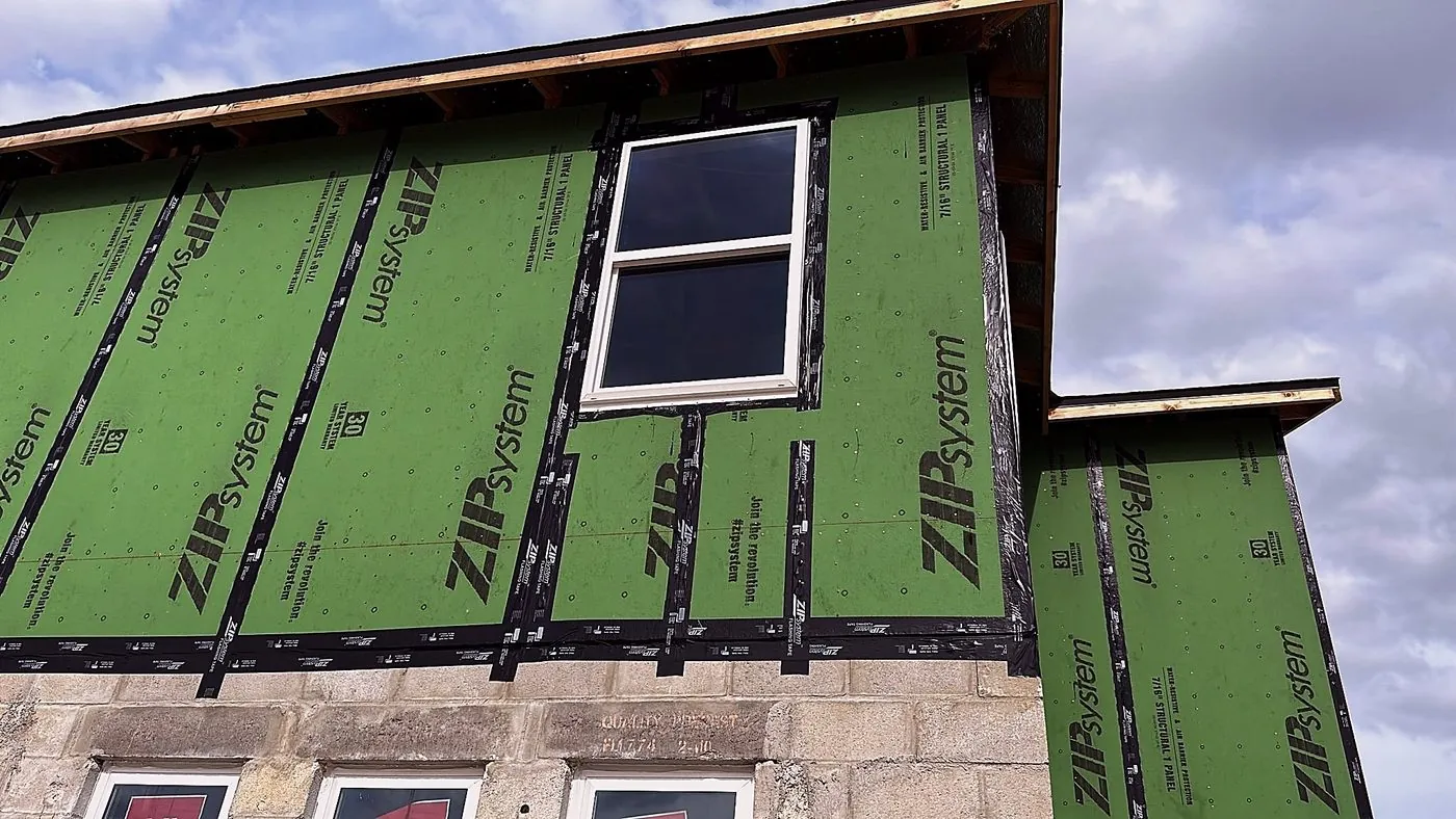 ZIP System sheathing with taped seams around a window opening